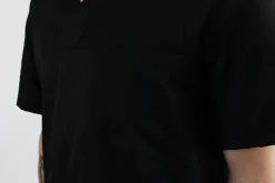 Veste de cuisine unisexe Egochef Leonardo noire polyester et coton à manches courtes